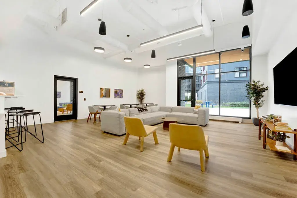 Community lounge with TV at Post Chicago Apartments - Co-living apartments in Chicago