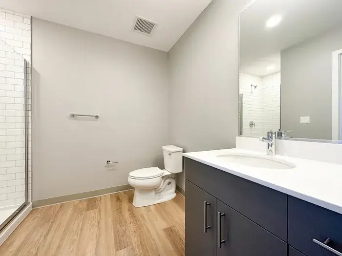Bathroom with mirror at Post Chicago Apartments, Lincoln Park furnished apartments.