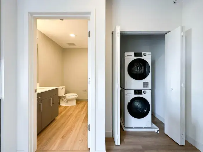 Bathroom and in-unit laundry at Post Chicago Apartments, Lincoln Park furnished apartments.
